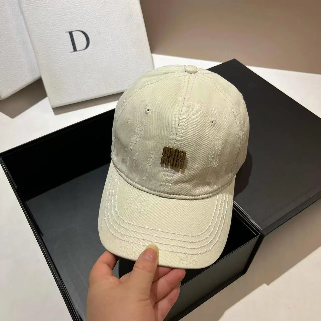 Miu Miu Distressed Cream Baseball Cap with Gold Logo